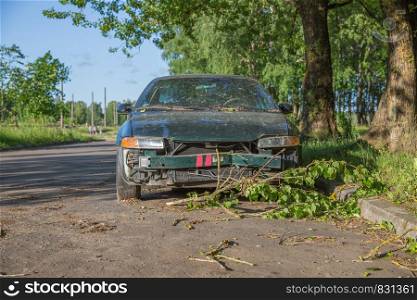 City Riga, Latvia Republic. A broken car is standing on the roadside. Juny 28. 2019 Travel photo.