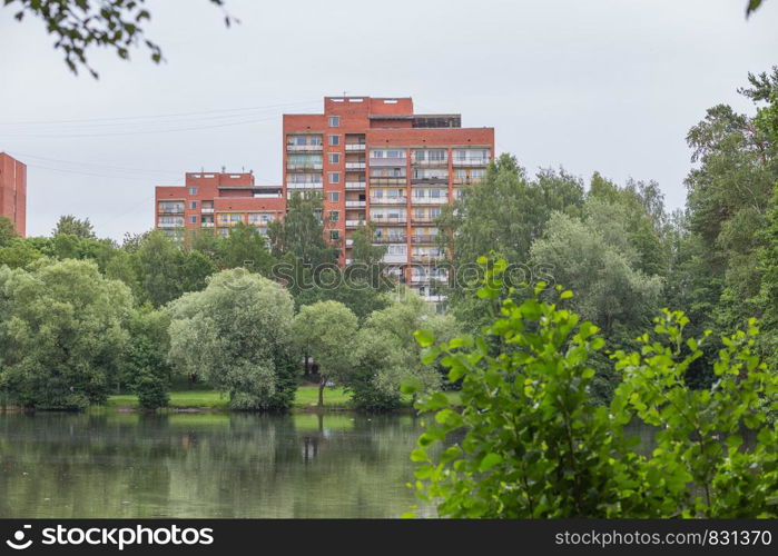 City Riga, Latvia Republic. Apartment house and nature. Riga neighborhood. Juny 29. 2019 Travel photo.
