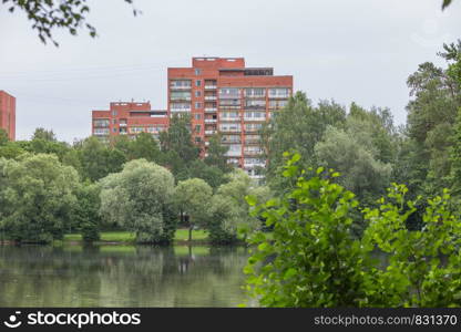 City Riga, Latvia Republic. Apartment house and nature. Riga neighborhood. Juny 29. 2019 Travel photo.