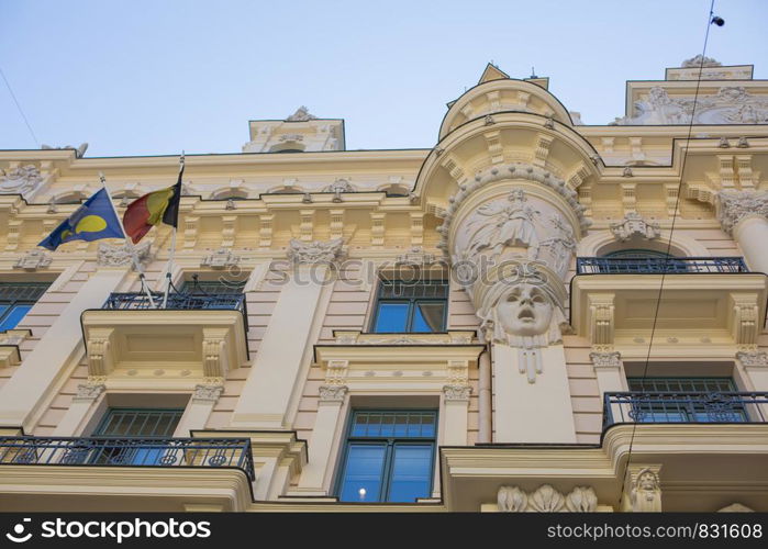 City Riga, Latvian Republic. An old building with interesting sculptures and ornaments. 2019. 24. July. Travel photo.