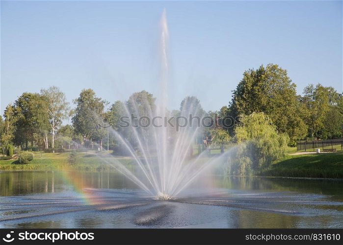 City Riga, Latvian Republic. City fountain and surrounding nature. 2019. 27. July. Travel photo.