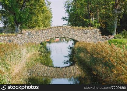 City Rundale, Latvia Republic. Park with old bridge. Sep 9. 2019 Travel photo.