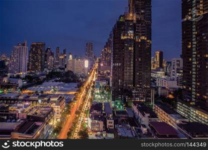 City scape of building, skyscraper in the Silom/Sathon central business district of Bangkok at night
