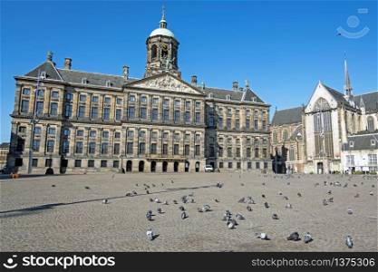 City scenic from Amsterdam at the Dam Square with the Royal Palace in the Netherlands