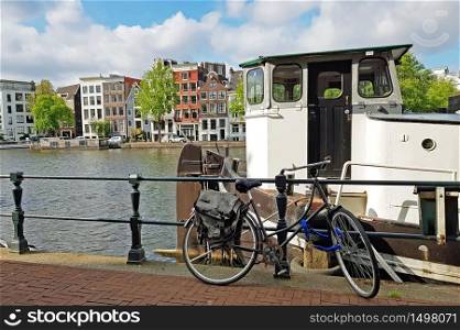 City scenic from Amsterdam at the river Amstel in the Netherlands