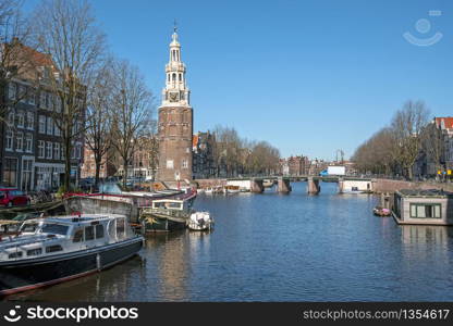 City scenic from Amsterdam in the Netherlands with the Montelbaan tower