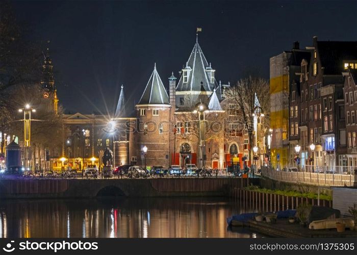 City scenic from Amsterdam in the Netherlands with the Waag building at night