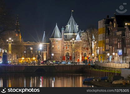 City scenic from Amsterdam in the Netherlands with the Waag building at night