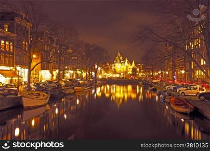 City scenic from Amsterdam with the Waag building in the Netherlands by night