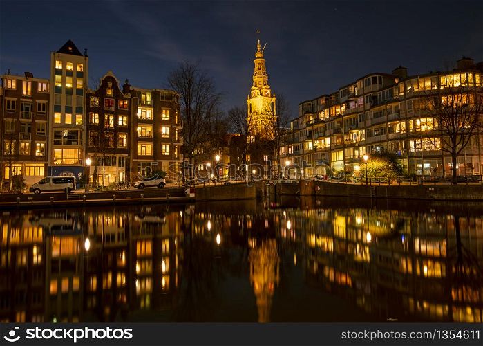 City scenic from Amsterdam with the Zuiderkerk in the Netherlands at night