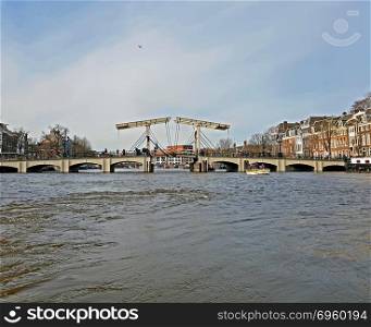 City scenic from the city Amsterdam with the Tiny Bridge in the Netherlands. City scenic from the city Amsterdam with the Tiny Bridge in the