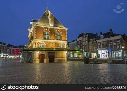 City scenic from the city Leeuwarden with the Waag building in the Netherlands at night