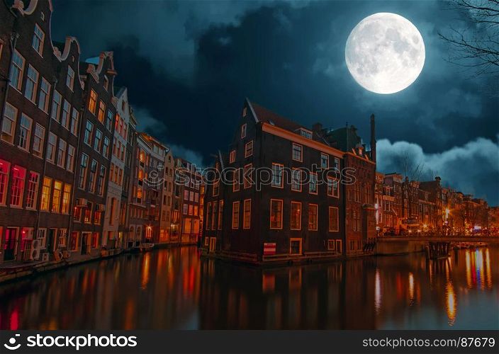 City scenic in Amsterdam the Netherlands at night by full moon
