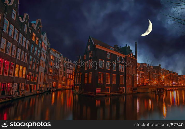 City scenic in Amsterdam the Netherlands at night by half moon