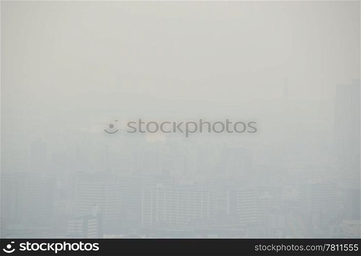 City skyline on a foggy day. Skyline of an asian city on a foggy day, smog