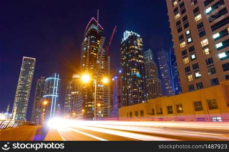 City street and modern skyscrapers at night, Dubai Marina, United Arab Emirates - Cityscape, wide angle shot