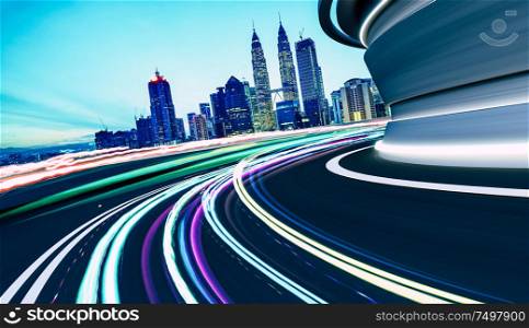 City street road with motion blur and speed light trail effect . Evening scene .Transportation concept .