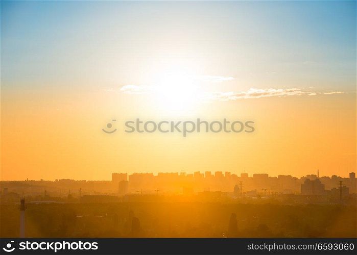 City sunset with buildings silhouette on orange skyline