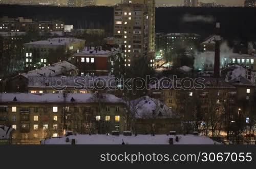 City time lapse at night. Factory chimney with smoke. Moscow, aerial view. Wide shot, high angle.