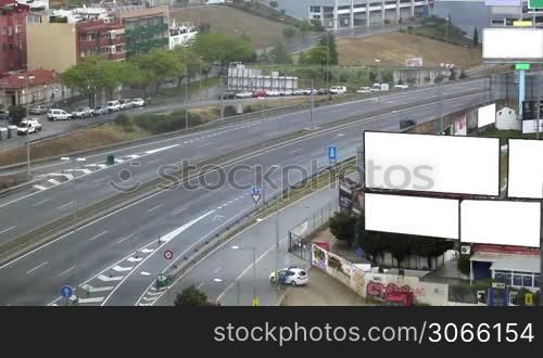 City timelapse with empty billboards on a highway. Space for your text or image.