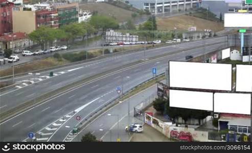 City timelapse with empty billboards on a highway. Space for your text or image.