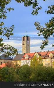 City tower with clock and old buildings, trees in Bamberg, Germany&#xA;