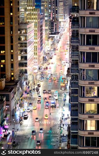 City traffic at night, aerial view of main avenue, New York City.