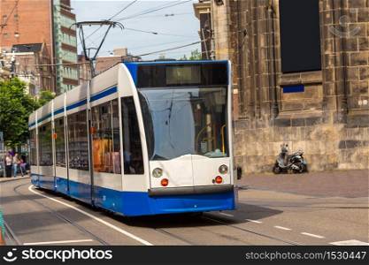 City tram in Amsterdam in a beautiful summer day, The Netherlands