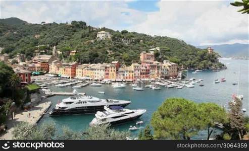 City view of Portofino and its port with boats and sailboats, Italy. Sequence