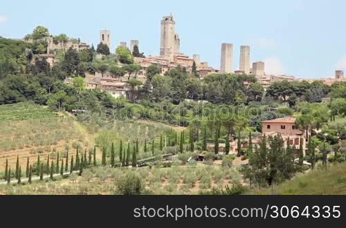 City view of San Gimignano, Tuscany, Italy: famous monuments, towers and town. Sequence