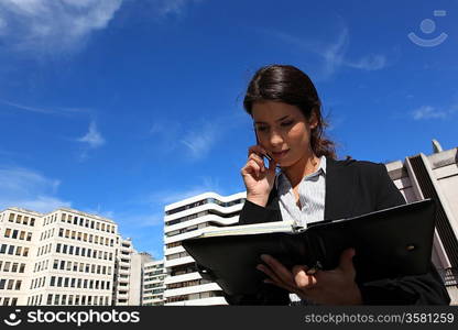 City woman making an appointment in her diary