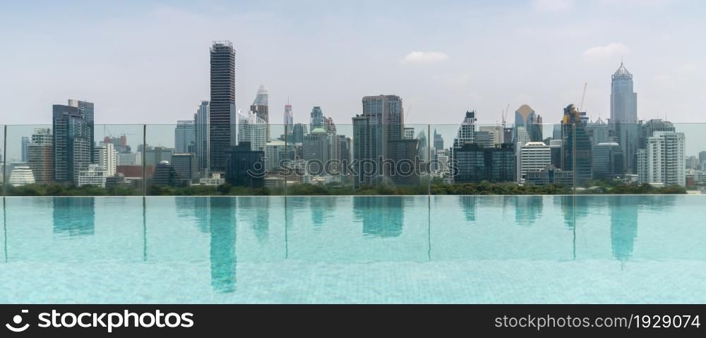 Cityscape and high-rise buildings in metropolis city with water reflection in the early morning .. Cityscape and high-rise buildings in metropolis city with water reflection