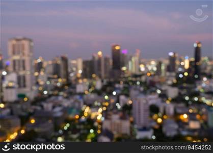 Cityscape blurred abstract background with bokeh urban lights at twilight