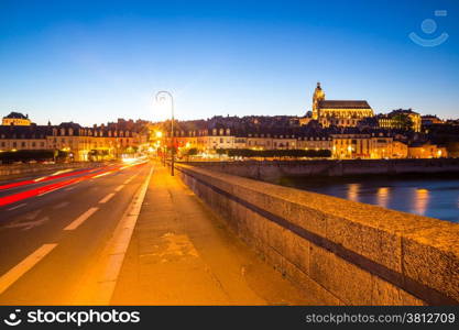 Cityscape of Blois with Cathedral over Loire river France at dusk