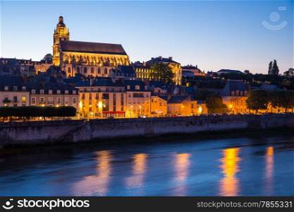 Cityscape of Blois with Cathedral over Loire river France at dusk