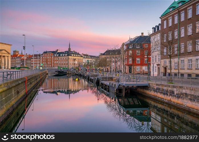 Cityscape of downtown Copenhagen city skyline in Denmark at sunset