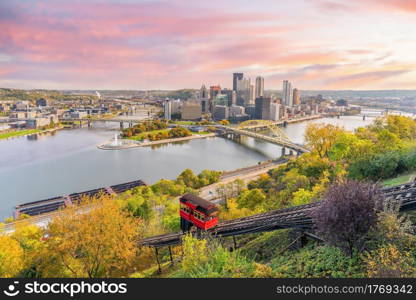 Cityscape of downtown skyline and vintage incline in Pittsburgh, Pennsylvania, USA at sunset
