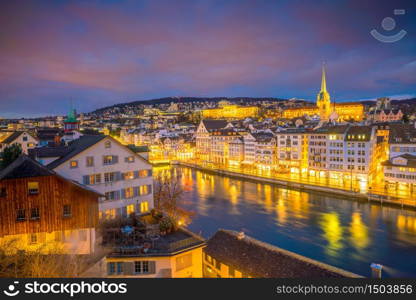 Cityscape of downtown Zurich in Switzerland during dramatic sunset.