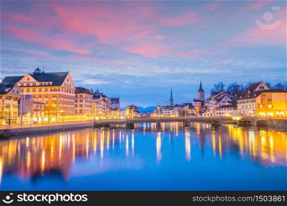 Cityscape of downtown Zurich in Switzerland during dramatic sunset.