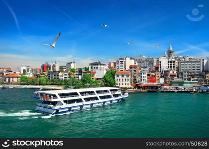 Cityscape of Istanbul with the view on Galata Tower and boats in Golden Horn bay, Turkey