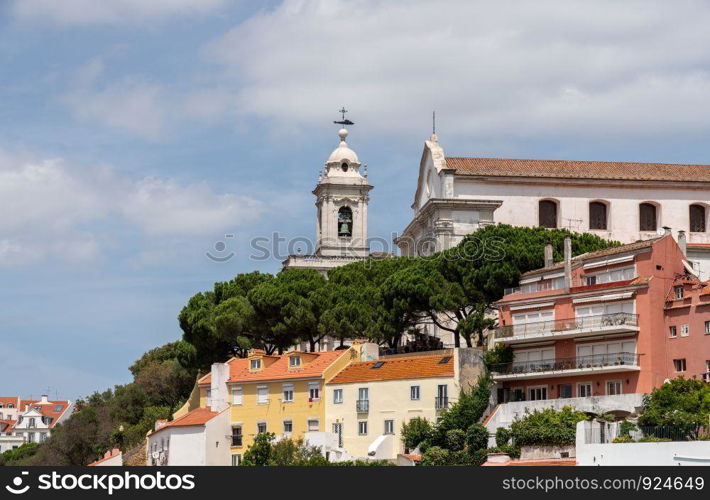 Cityscape of Lisbon with bell tower of the Graca church in the Alfama district. Bell tower of Graca church in Alfama district of Lisbon