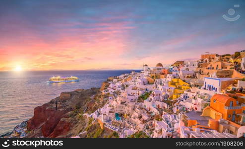 Cityscape of Oia town in Santorini island, Greece. Panoramic view at the sunset.