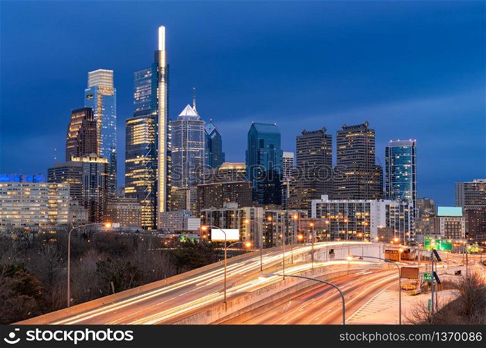 Cityscape of Philadelphia skyscraper Skylines building twilight dusk sunset with highway urban road transportation in Philly city downtown of Philadelphia in PA USA. Cityscape Urban lifstyle concept.