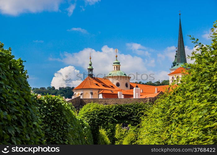 Cityscape of Prague in summer. Trees, leaves, sky