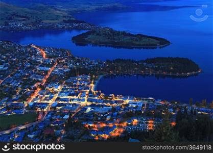 Cityscape of queenstown with lake Wakatipu from top at dusk.