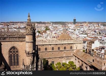Cityscape of Seville in Spain, on the first plan Gothic style architecture of Seville Cathedral.
