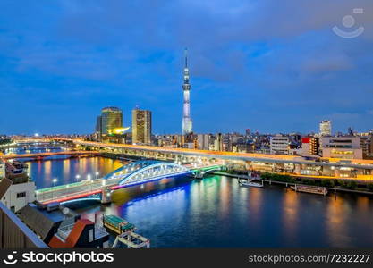 Cityscape of Tokyo skyline, panorama view of office building at Sumida river in Tokyo in the evening. Japan, Asia. . Cityscape of Tokyo skyline, panorama view of office building at Sumida river in Tokyo in the evening.