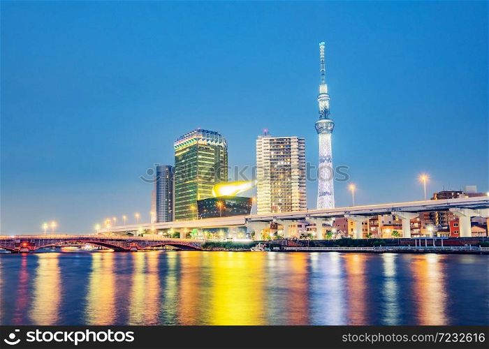 Cityscape of Tokyo skyline, panorama view of office building at Sumida river in Tokyo in the evening. Japan, Asia. . Cityscape of Tokyo skyline, panorama view of office building at Sumida river.
