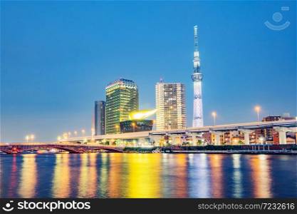 Cityscape of Tokyo skyline, panorama view of office building at Sumida river in Tokyo in the evening. Japan, Asia. . Cityscape of Tokyo skyline, panorama view of office building at Sumida river.