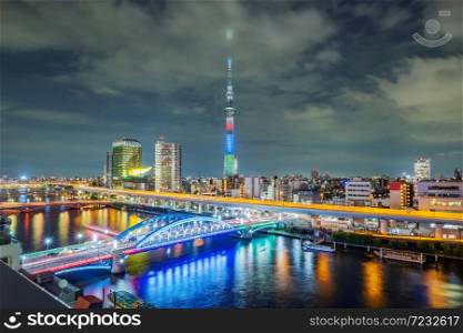 Cityscape of Tokyo skyline, panorama view of office building at Sumida river in Tokyo in the evening. Japan, Asia. . Cityscape of Tokyo skyline, panorama view of office building at Sumida river in Tokyo.